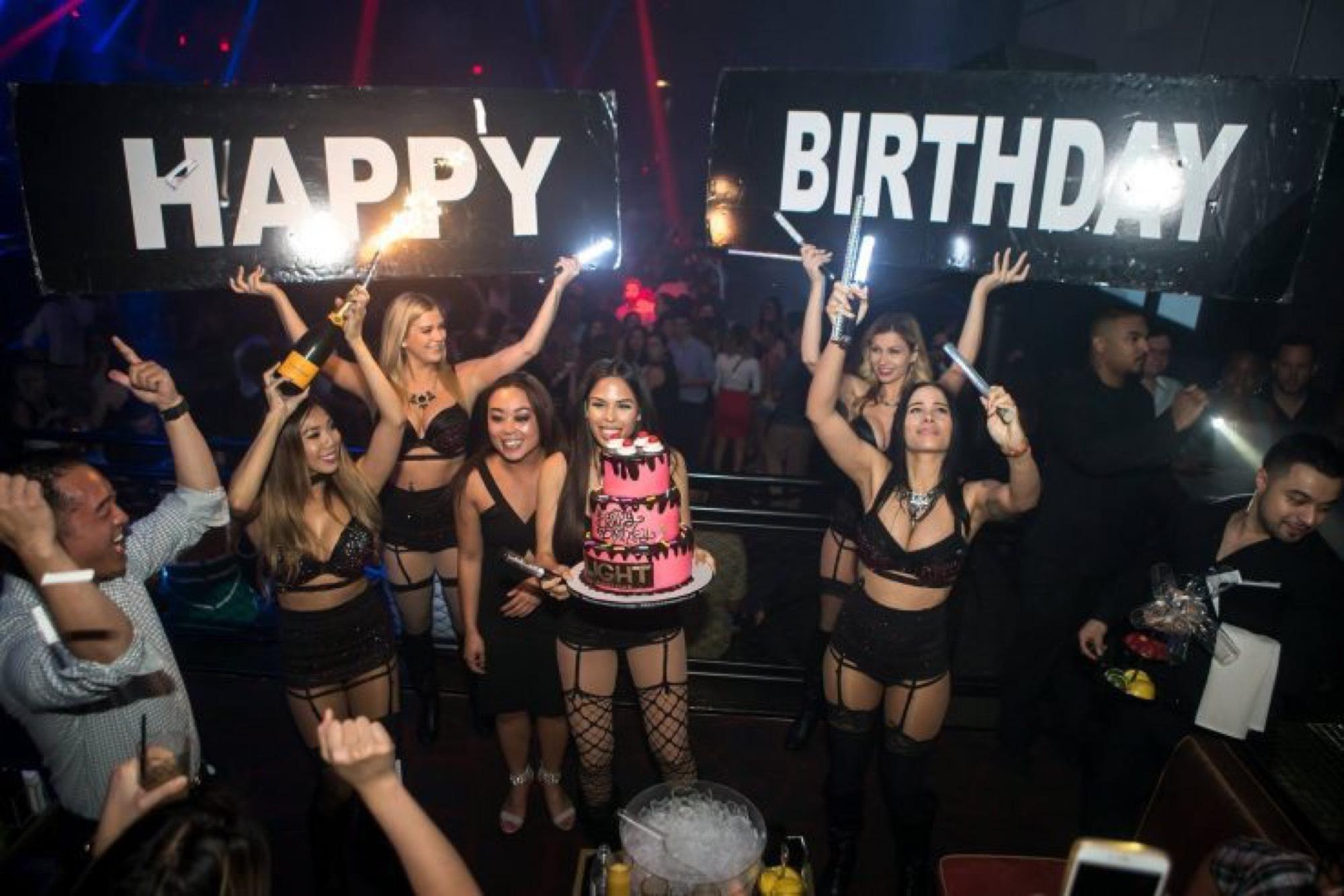Birthday guests posing together at a celebration