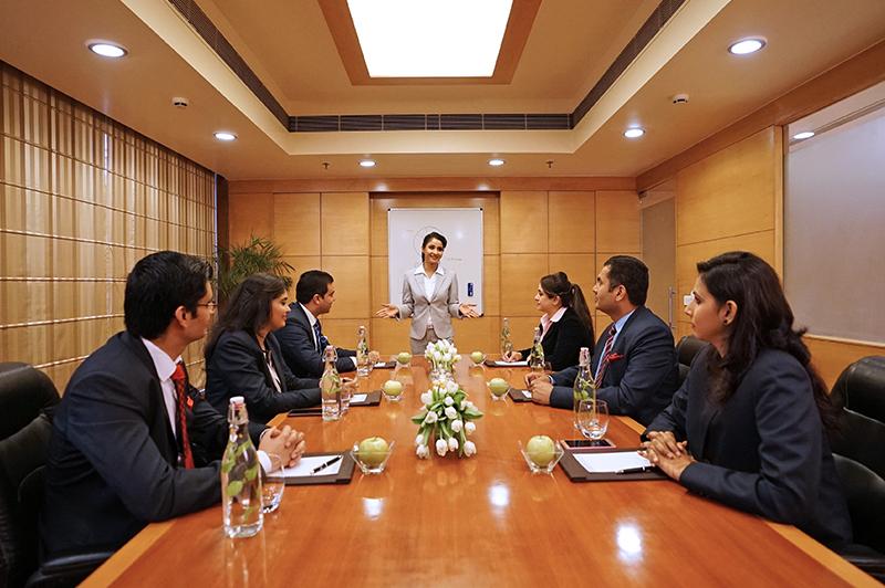 Expression coaching during a corporate headshot session in Mumbai