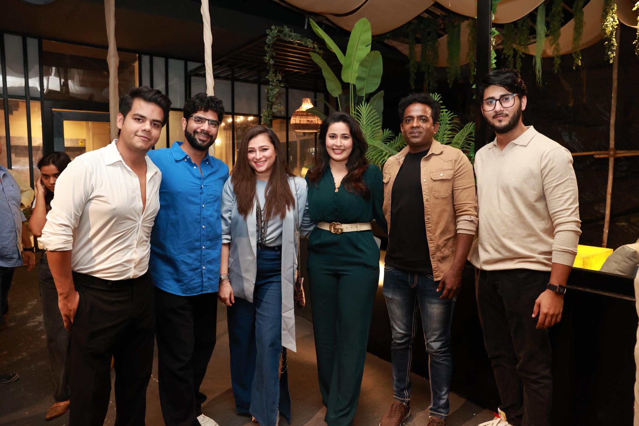 A group portrait of guests at an event venue